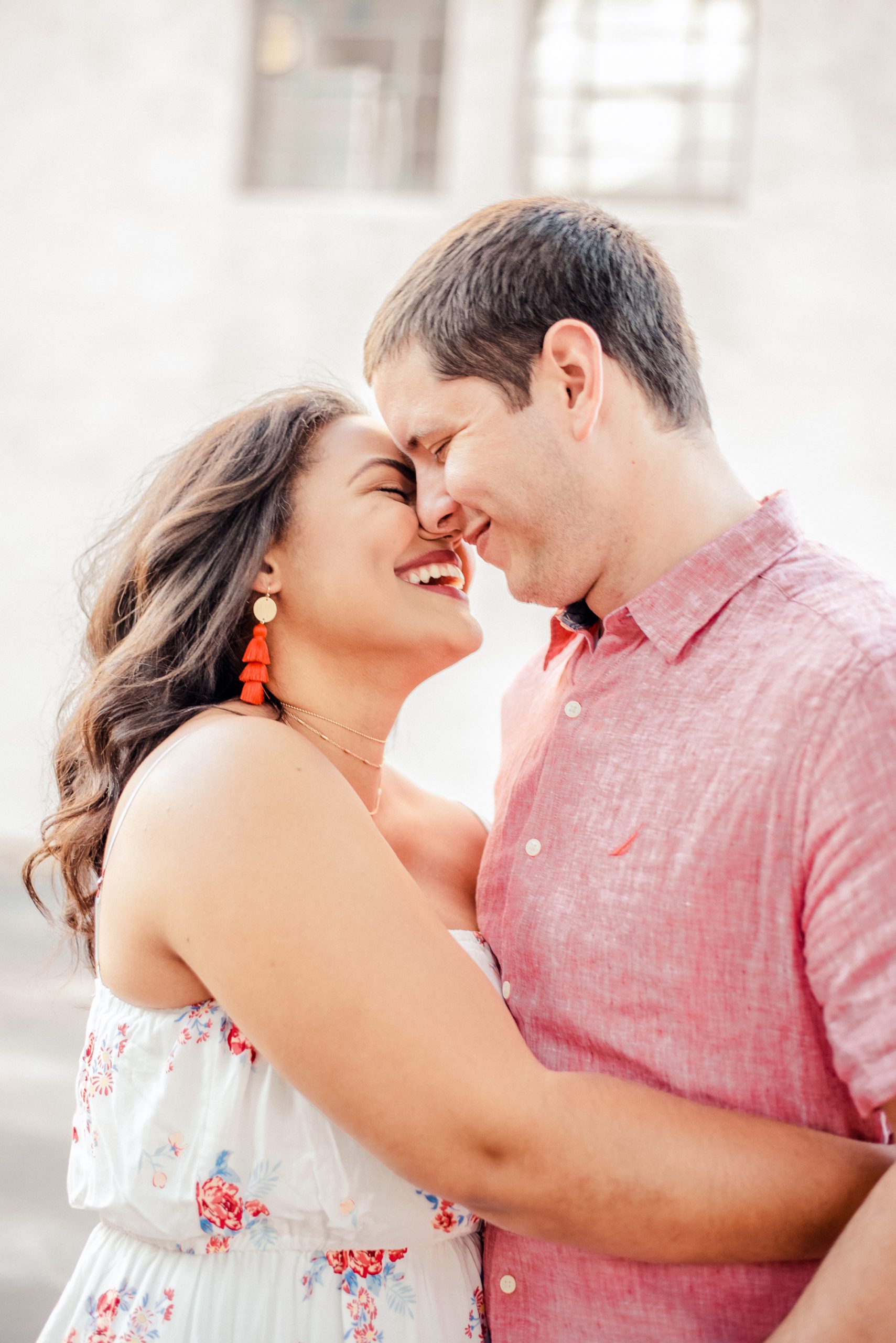 engaged couple smiling big while embracing with noses touching picture taken by Emily McIntyre Alabama Wedding Photographer